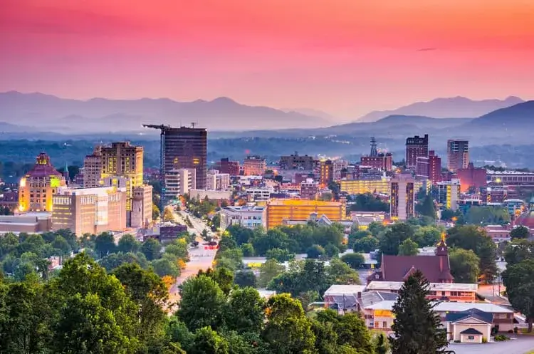 Downtown Asheville, North Carolina with the Blue Ridge Mountains behind it
