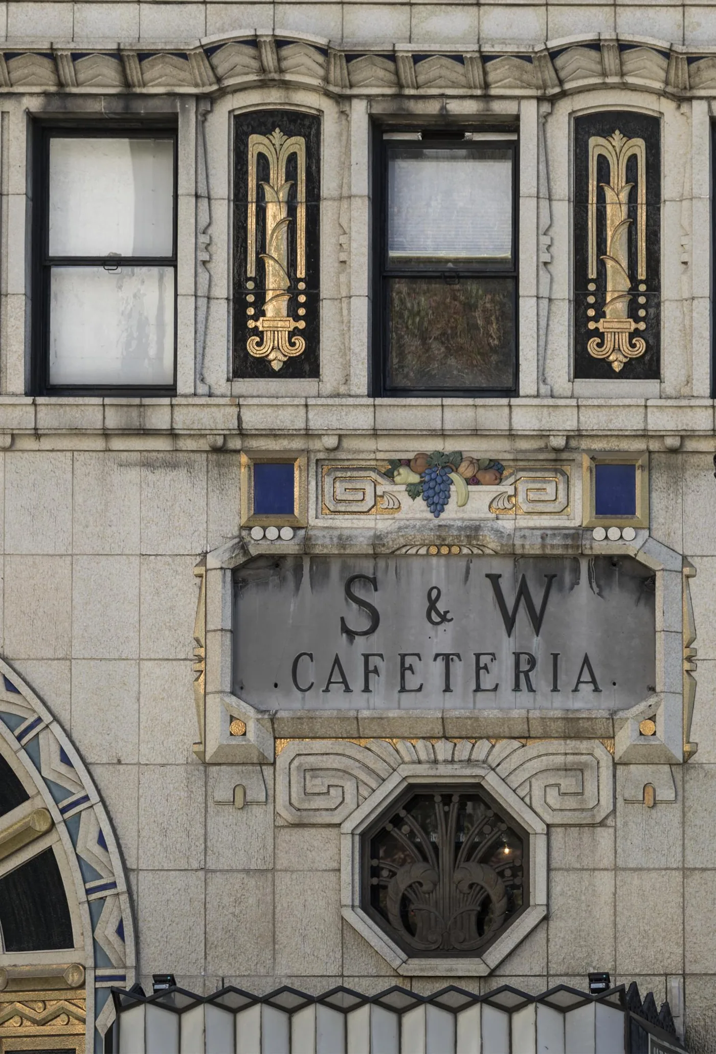 Gilded Art Deco ornament and lettering on the facade of the S and W Cafeteria building in downtown Asheville